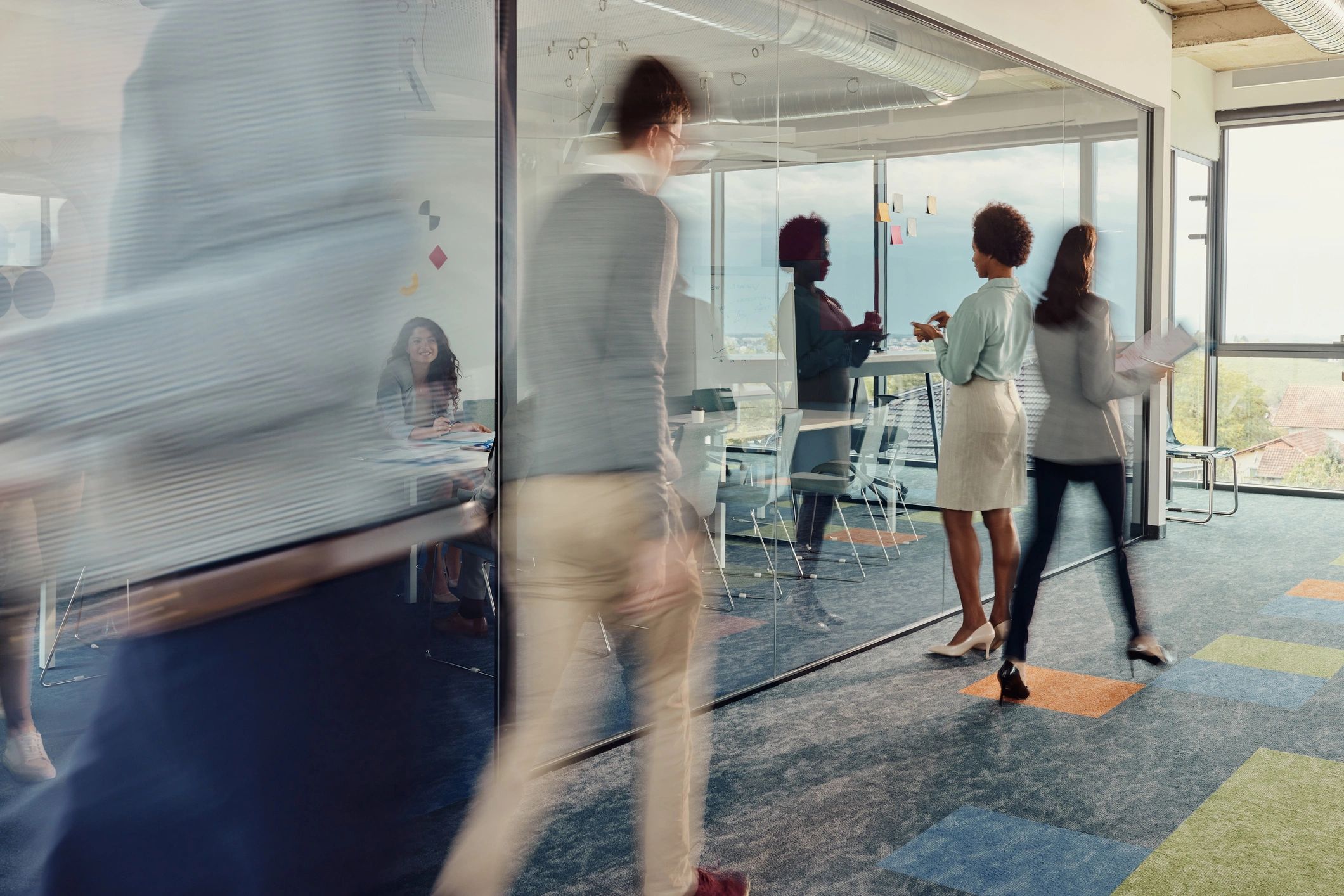 Busy modern office environment representing commercial clients