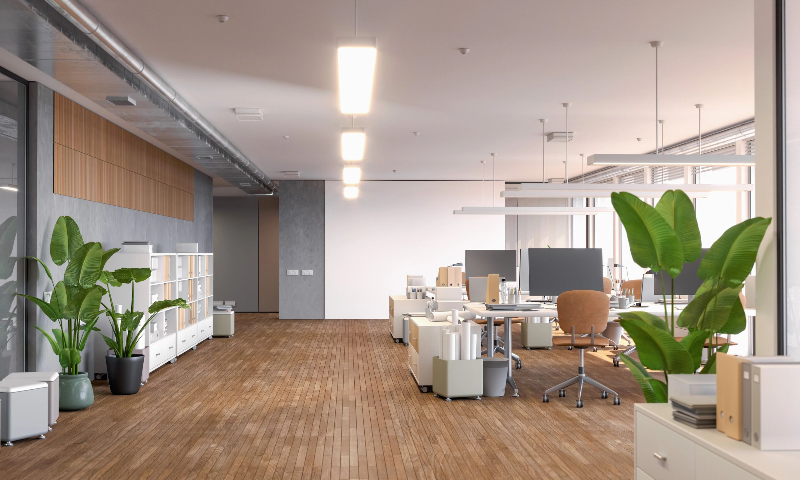 Cozy modern office interior with desks, computers, and plants