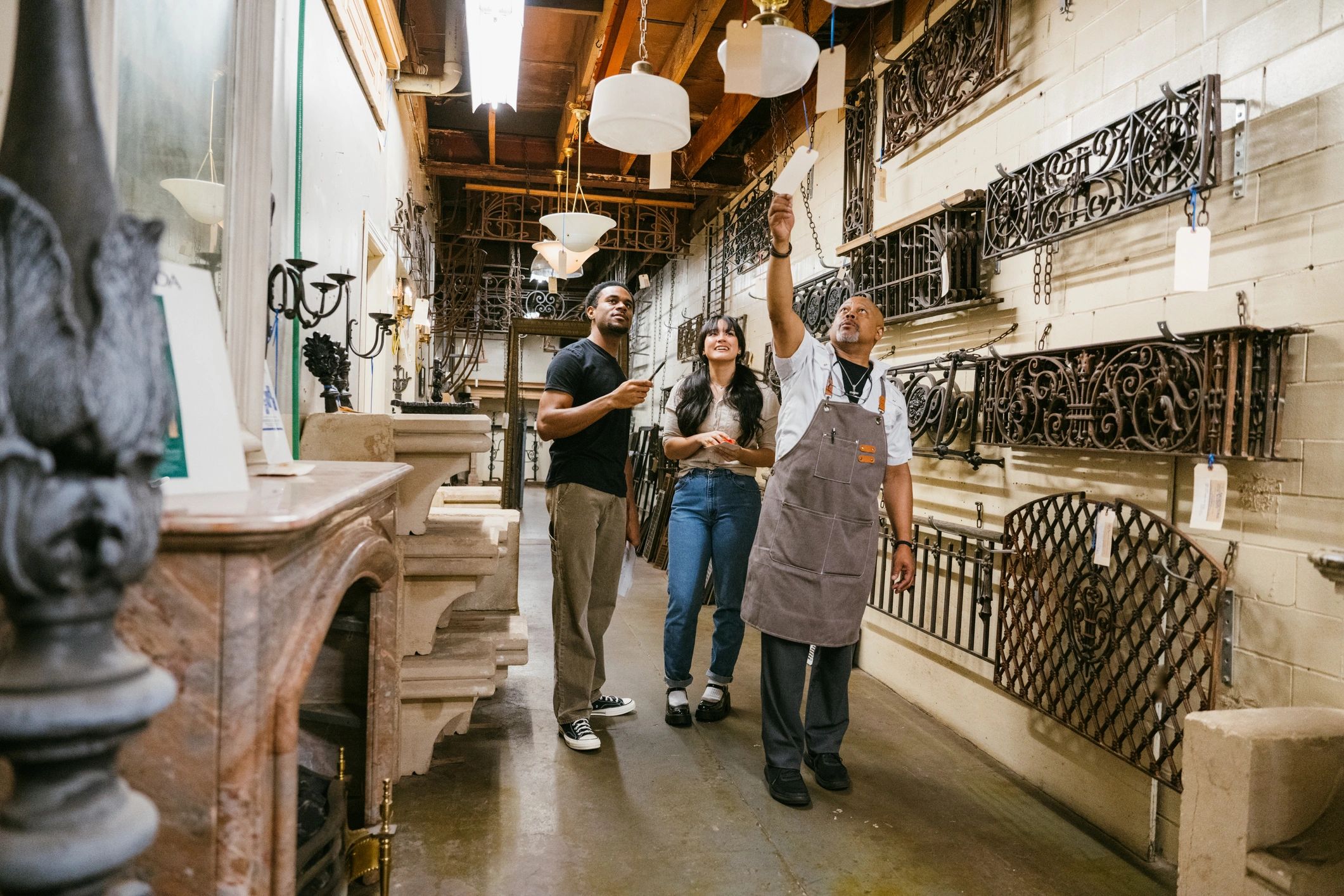 Retail store staff assisting customers in a clean showroom