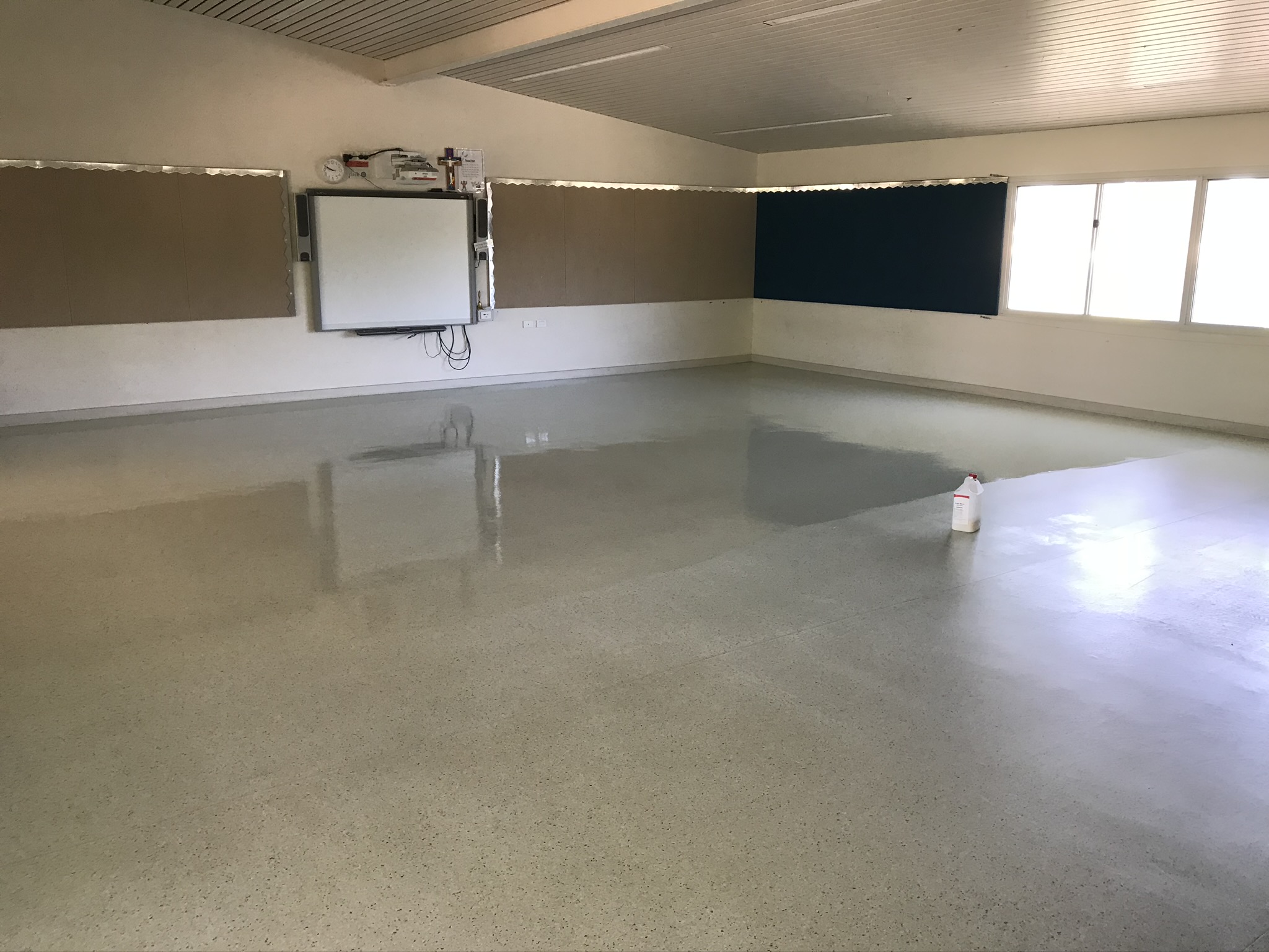 Polished vinyl floor after strip and seal service